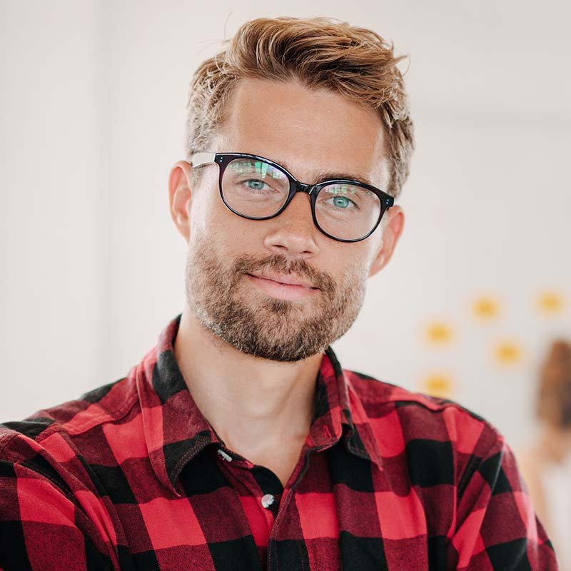 portrait of positive businessman in office PNPWR2X RG Services Multiservices